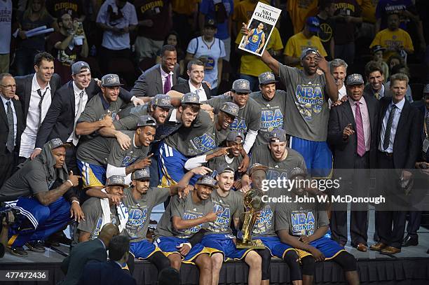 Finals: Golden State Warriors players victorious with Larry O'Brien Trophy after winning Game 6 and championship series vs Cleveland Cavaliers at...