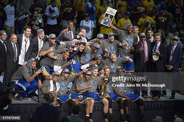 Finals: Golden State Warriors players victorious with Larry O'Brien Trophy after winning Game 6 and championship series vs Cleveland Cavaliers at...