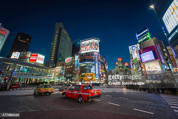 tokyo nights neon lights taxis traffic crowds of people japan - shinjuku stock pictures, royalty-free photos & images