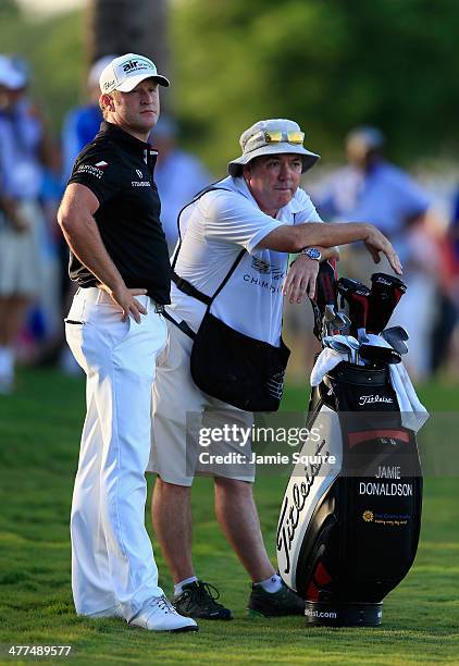 Jamie Donaldson of Wales waits with his caddie Mick Donaghy on the 18th hole during the final round of the World Golf Championships-Cadillac...