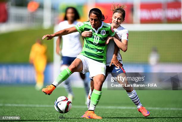 Stephany Mayor of Mexico is challenged by Laure Boulleau of France during the FIFA Women's World Cup 2015 Group F match between Mexico and France at...