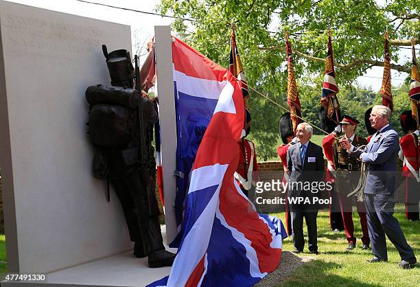 Prince Charles, Prince of Wales reveals a new artwork during a ceremony held at Hougoumont Farm to mark the bicentenary of the battle on June 17,...