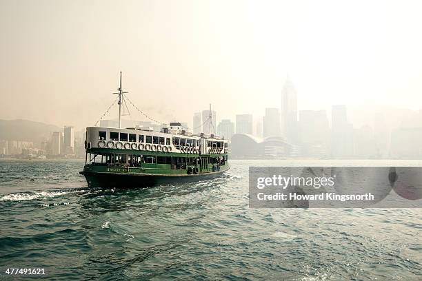 star ferry in the mist hong kong harbour - ferry stock pictures, royalty-free photos & images