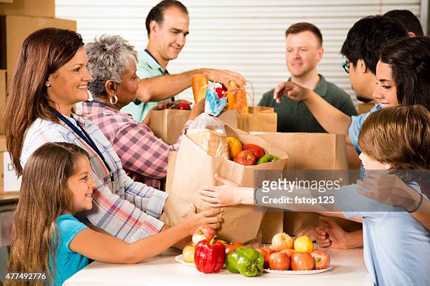 group of volunteers provide groceries donations to needy families. charity. - kind child stock pictures, royalty-free photos & images