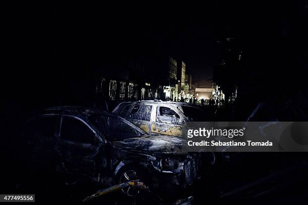 Cars sit destroyed by a car-bomb outside the Green Dome mosque on June 17, 2015 in Sana'a, Yemen. News outlets have reported that the Islamic State,...