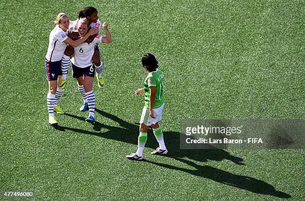 Amandine Henry of France celebrates with team mates Sabrina Delannoy of France and Elodie Thomis of France after scoring her teams fifth goal during...