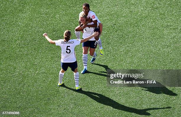 Amandine Henry of France celebrates with team mates Sabrina Delannoy of France and Elodie Thomis of France after scoring her teams fifth goal during...