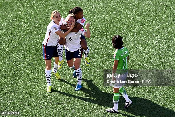 Amandine Henry of France celebrates with team mates Sabrina Delannoy of France and Elodie Thomis of France after scoring her teams fifth goal during...