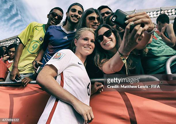 Amandine Henry of France takes a selfie with fans after the FIFA Women's World Cup 2015 Group F match between Mexico and France at Lansdowne Stadium...