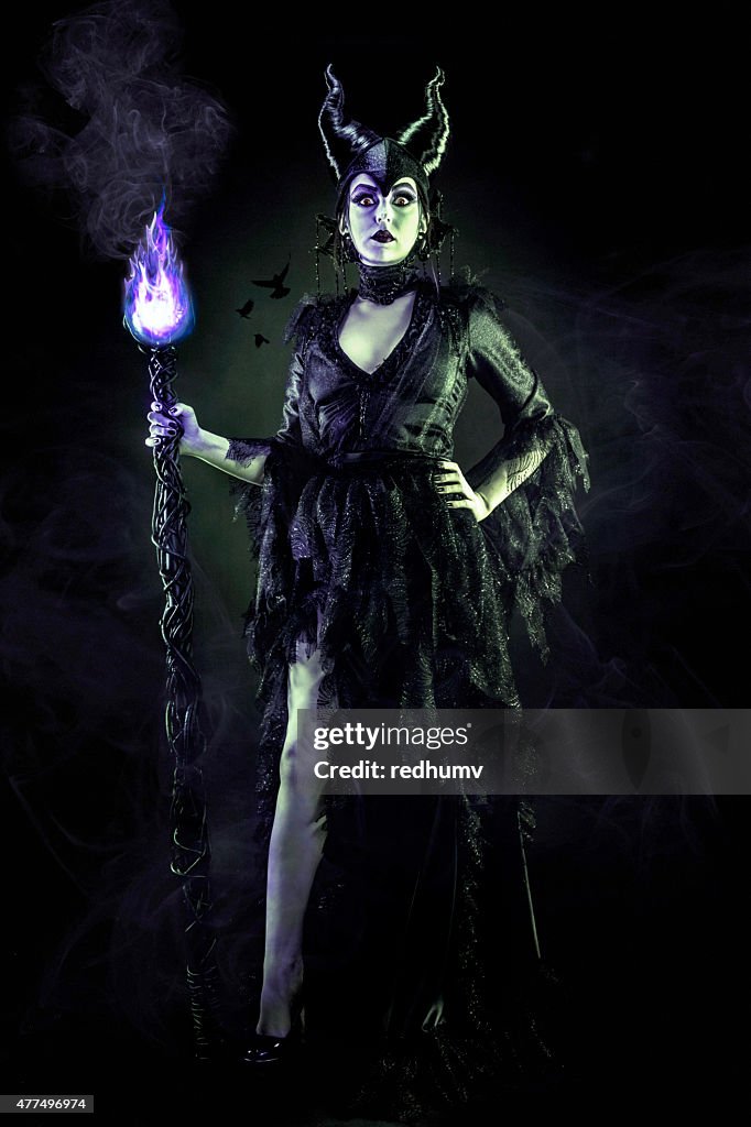 Evil Sorceress in Black Gown and Magic Staff