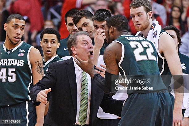 Head Coach Tom Izzo of the Michigan State Spartans and Branden Dawson of the Michigan State Spartans argue during a timeout in the second half...