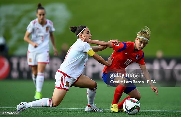 Veronica Boquete of Spain challenges Yumi Kang of Korea during the FIFA Women's World Cup 2015 Group E match between Korea Republic and Spain at...