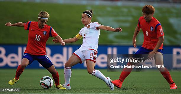 Veronica Boquete of Spain challenges for the ball with Kang Yumi and Park Eunsun of Korea Republic during the FIFA Women's World Cup 2015 Group E...