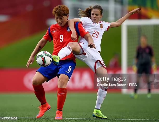 Eunsun Park of Korea is challenged by Irene Paredes of Spain during the FIFA Women's World Cup 2015 Group E match between Korea Republic and Spain at...