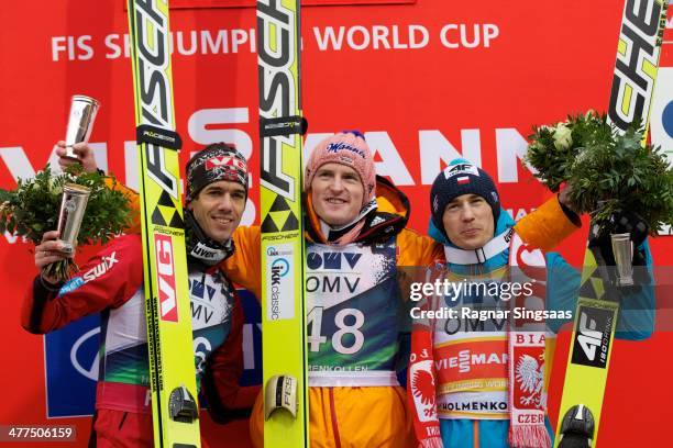 Anders Bardal of Norway second place, Severin Freund of Germany first place and Kamil Stoch of Poland third place during the FIS Ski Jumping World...