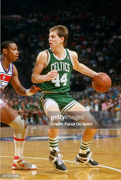 Danny Ainge of the Boston Celtics dribbles the ball against the Washington Bullets during an NBA basketball game circa 1985 at the Capital Centre in...