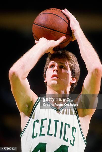 Danny Ainge of the Boston Celtics shoots a free throw against the Los Angeles Lakers during an NBA basketball game circa 1984 at the Boston Garden in...