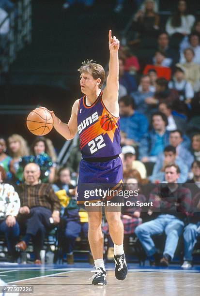 Danny Ainge of the Phoenix Suns dribbles the ball up court against the Dallas Mavericks during an NBA basketball game circa 1993 at the Reunion Arena...