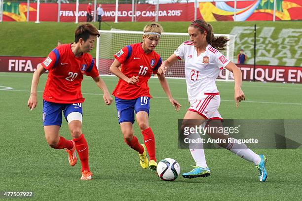 Hyeri Kim and Yumi Kang of Korea Republic defend against Alexia Putellas of Spain during the FIFA Women's World Cup Canada 2015 Group E match between...