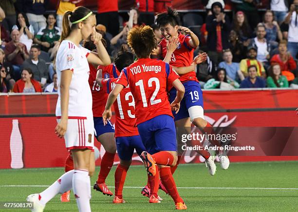 Sooyun Kim of Korea Republic celebrates with team mates after scoring her team's second goal during the FIFA Women's World Cup Canada 2015 Group E...
