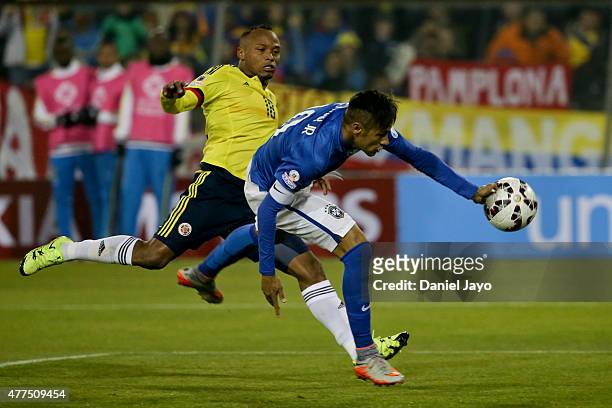 Camilo Zuñiga of Colombia and Neymar of Brazil as he controles the ball with his hand during the 2015 Copa America Chile Group C match between Brazil...
