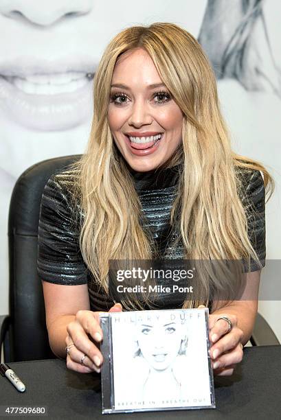 Hilary Duff attends her "Breathe In, Breathe Out" CD signing event at the Smith Haven Mall on June 17, 2015 in Lake Grove, New York.