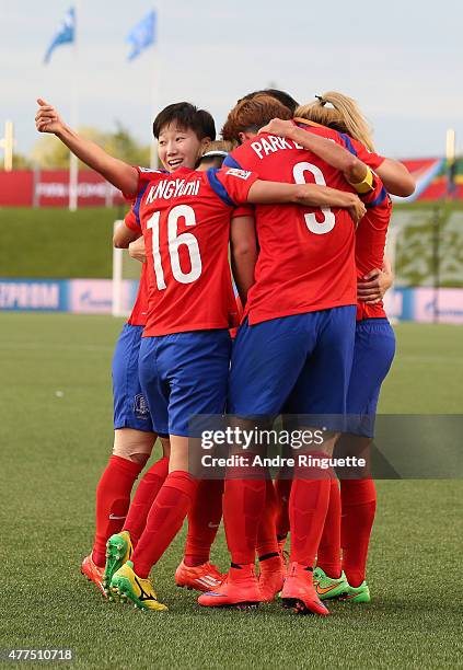 Hahnul Kwon of Korea Republic celebrates with team mates her team's first goal during the FIFA Women's World Cup Canada 2015 Group E match between...