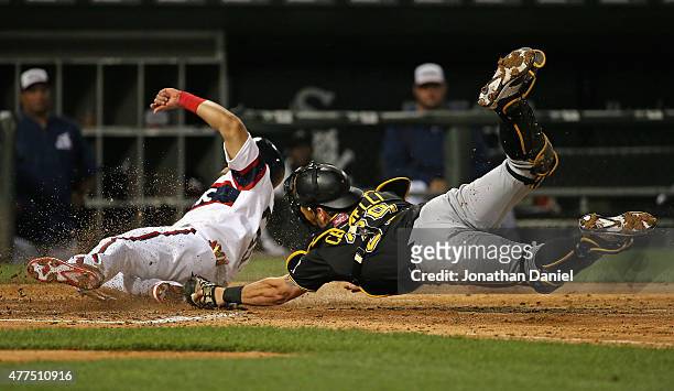 Melky Cabrera of the Chicago White Sox crosses the plate to score a run in the 6th inning as Francisco Cervelli of the Pittsburgh Pirates dives...