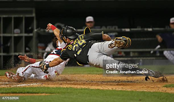 Melky Cabrera of the Chicago White Sox crosses the plate to score a run in the 6th inning as Francisco Cervelli of the Pittsburgh Pirates dives...