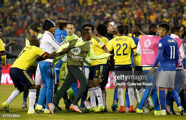 Pablo Armero of Colombia tries to calm down Robinho of Brazil after the 2015 Copa America Chile Group C match between Brazil and Colombia at...