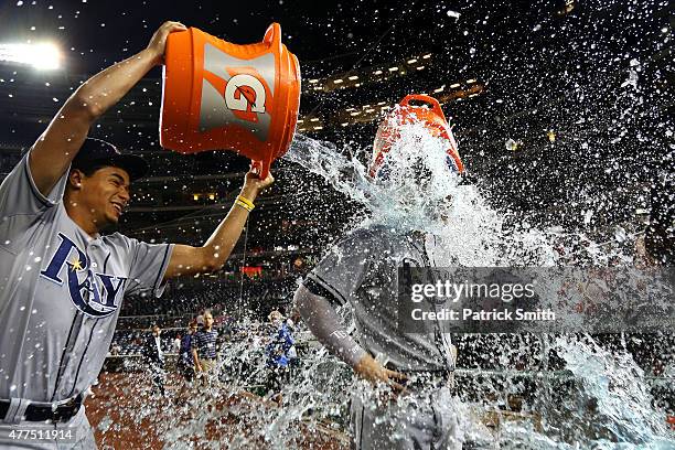 Steven Souza Jr. #20 of the Tampa Bay Rays is doused by teammate Chris Archer and David DeJesus after defeating the Washington Nationals at Nationals...