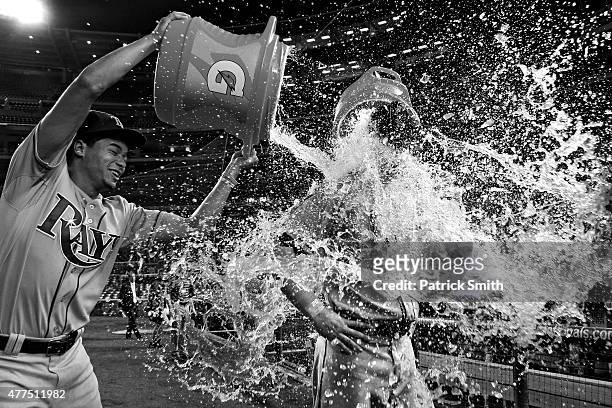 Steven Souza Jr. #20 of the Tampa Bay Rays is doused by teammate Chris Archer and David DeJesus after defeating the Washington Nationals at Nationals...