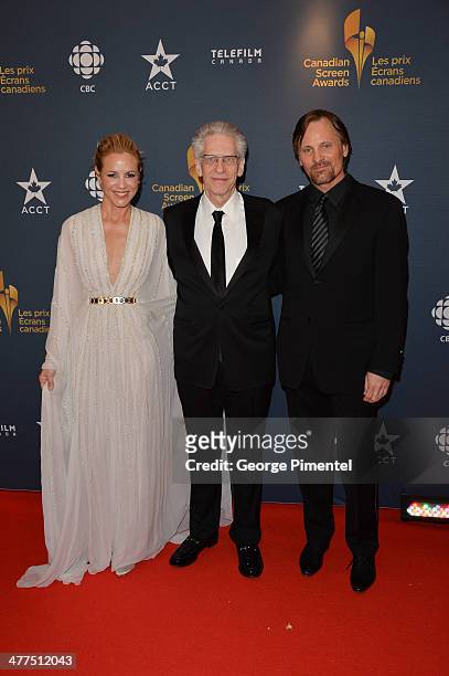 Maria Bello, David Cronenberg and Viggo Mortensen arrive at the Canadian Screen Awards at Sony Centre for the Performing Arts on March 9, 2014 in...