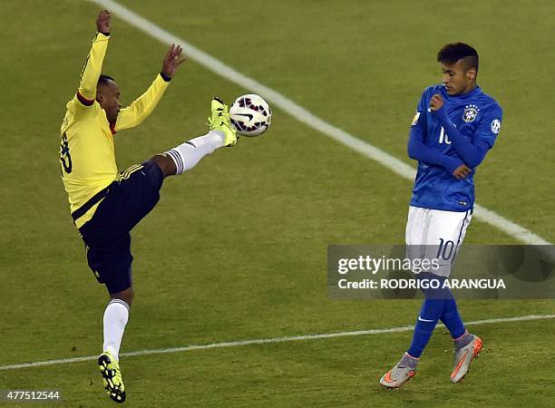 Colombia's defender Camilo Zuniga and Brazil's forward Neymar vie during a 2015 Copa America football championship match in Santiago, Chile, on June...
