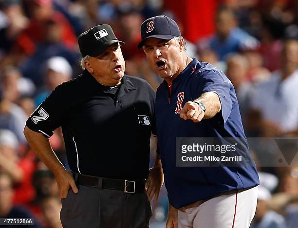 Manager John Farrell of the Boston Red Sox argues with first base umpire Larry Vanover in the seventh inning during the game against the Atlanta...