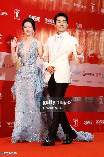 Actor Song Seung-heon and actress Liu Yifei arrive at the red carpet of I-SIFF Gala Night during the 18th Shanghai International Film Festival at...