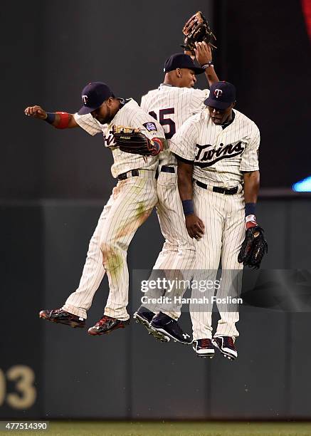 Eddie Rosario, Byron Buxton, and Torii Hunter of the Minnesota Twins celebrate a win of the game against the St. Louis Cardinals on June 17, 2015 at...