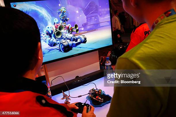 Attendees play the Skylanders game by Activision Blizzard Inc. During the E3 Electronic Entertainment Expo in Los Angeles, California, U.S., on...
