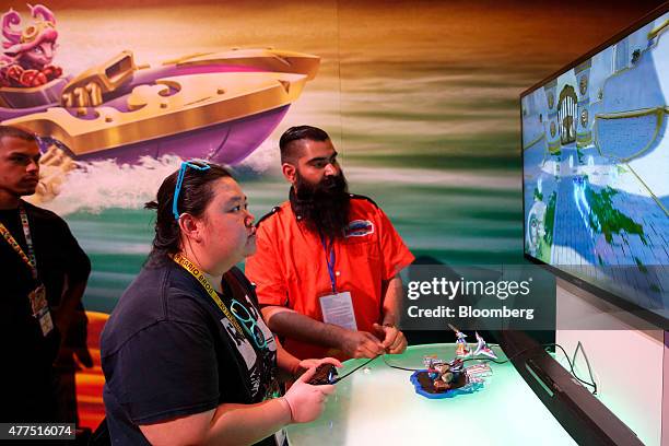 Attendees play the Skylanders game by Activision Blizzard Inc. During the E3 Electronic Entertainment Expo in Los Angeles, California, U.S., on...