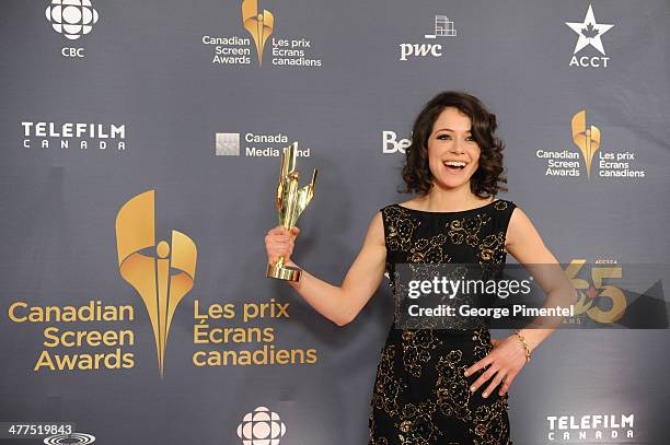 Tatiana Maslany, winner of the Best Perfomance by an Actress in a Continuing Leading Dramatic Role poses in the press room at the 2014 Canadian...