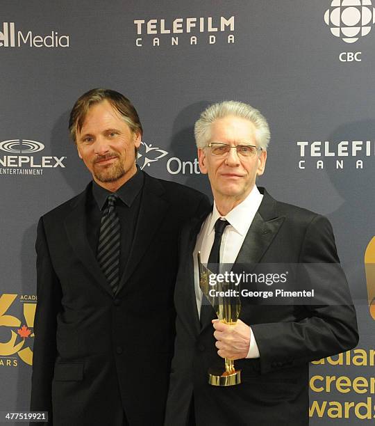 Presenter Viggo Mortensen and David Cronenberg, winner of the Lifetime acheivement award in the press room at the 2014 Canadian Screen Awards at Sony...