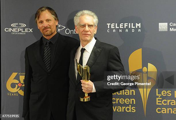 Presenter Viggo Mortensen and David Cronenberg, winner of the Lifetime acheivement award in the press room at the 2014 Canadian Screen Awards at Sony...