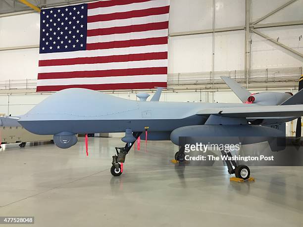 An MQ-9 Reaper aircraft sits in a maintenance bay at Creech Air Force Base in Nevada, where the U.S. Air Force oversees unmanned flight operations...