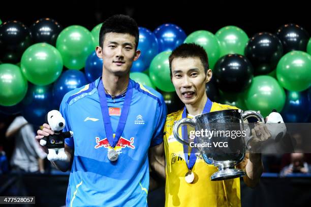 Lee Chong Wei of Malaysia and Chen Long of China pose for photograph after their All England Open Badminton Championships men's singles final match...