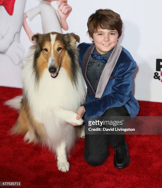 Actor Max Charles poses with Lassie at the premiere of Twentieth Century Fox and DreamWorks Animation's "Mr. Peabody & Sherman" at the Regency...