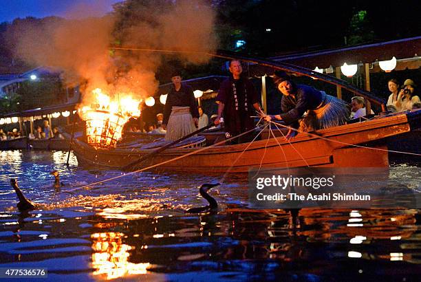 Female 'Usho', cormorant master uses cormorants to catch 'Ayu', sweetfishes during the 'Ukai,' cormorant fishing in Ujigawa River on June 17, 2015 in...