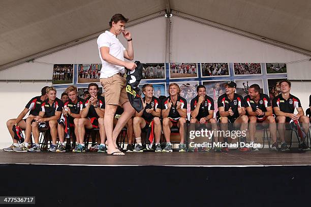 The Saints players reacts as Justin Koschitzke comes on stage to present his jumper during a St Kilda Saints AFL Fan Day at Frankston Foreshore on...