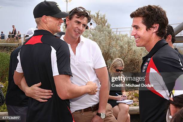 Nick Riewoldt and Lenny Hayes greet Justin Koschitzke during a St Kilda Saints AFL Fan Day at Frankston Foreshore on March 10, 2014 in Melbourne,...