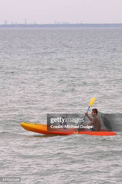 Sean Dempster kayaks with a young fan during a St Kilda Saints AFL Fan Day at Frankston Foreshore on March 10, 2014 in Melbourne, Australia.