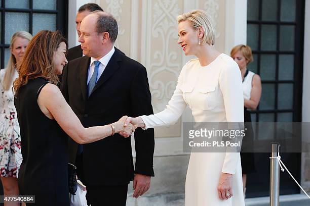Prince Albert II of Monaco and Princess Charlene of Monaco greet guest during the Monaco Palace cocktail party of the 55th Monte Carlo TV festival on...